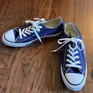 Blue low top converse. White laces. Size 8